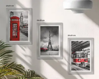 Bilderwand mit Motiven ikonischer Städte wie London und Paris sowie Schienenverkehr