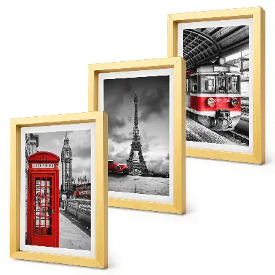 Bilderwand mit Motiven ikonischer Städte wie London und Paris sowie Schienenverkehr