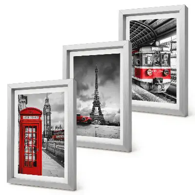Bilderwand mit Motiven ikonischer Städte wie London und Paris sowie Schienenverkehr