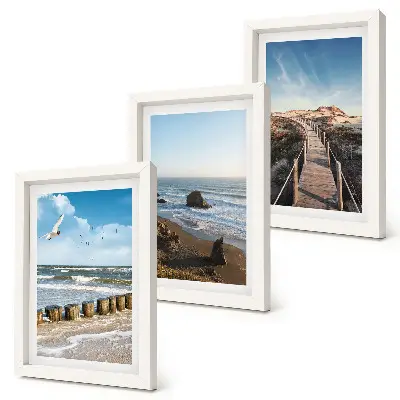 Fotowand mit Blick auf den Strand mit Wellen, Himmel und einer Strandpromenade