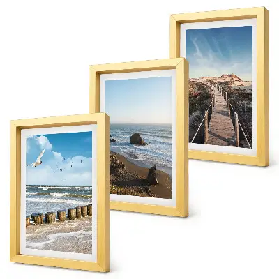 Fotowand mit Blick auf den Strand mit Wellen, Himmel und einer Strandpromenade