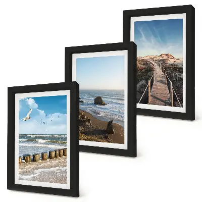 Fotowand mit Blick auf den Strand mit Wellen, Himmel und einer Strandpromenade