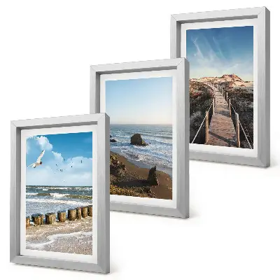 Fotowand mit Blick auf den Strand mit Wellen, Himmel und einer Strandpromenade