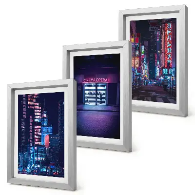 Bilderwand Nachtstadt mit Neonlichtern und Kinoeingang