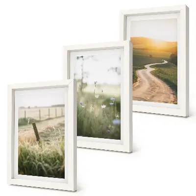 Bilderwand mit Landschaftsmotiv von Wiese, Straße und Sonnenuntergang