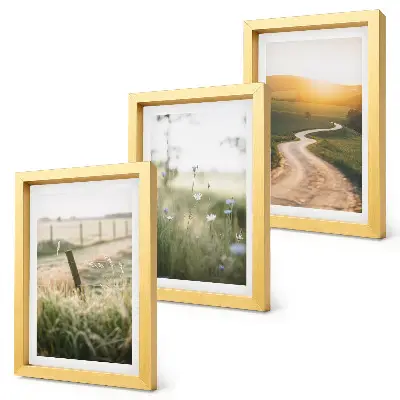 Bilderwand mit Landschaftsmotiv von Wiese, Straße und Sonnenuntergang