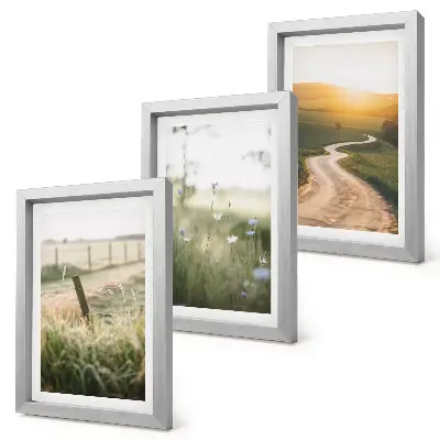 Bilderwand mit Landschaftsmotiv von Wiese, Straße und Sonnenuntergang