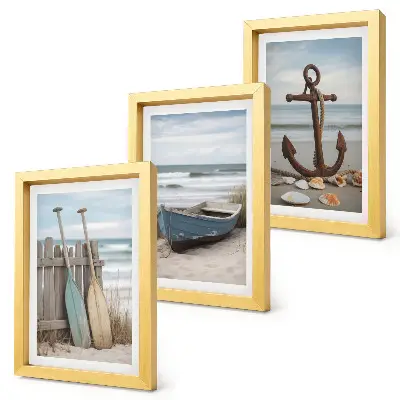 Bilderwand mit Motiv von Strand, Ruderboot und Anker im Sand