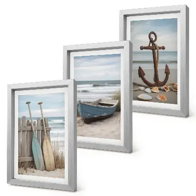 Bilderwand mit Motiv von Strand, Ruderboot und Anker im Sand