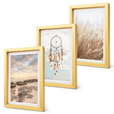 Fotowand Meerblick mit Wolken, Traumfänger und Gras