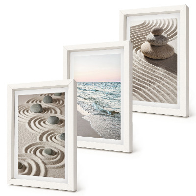 Fotowand Ruhige Wellen aus Sand und Wasser mit Steinen am Strand