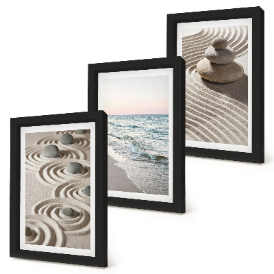 Fotowand Ruhige Wellen aus Sand und Wasser mit Steinen am Strand