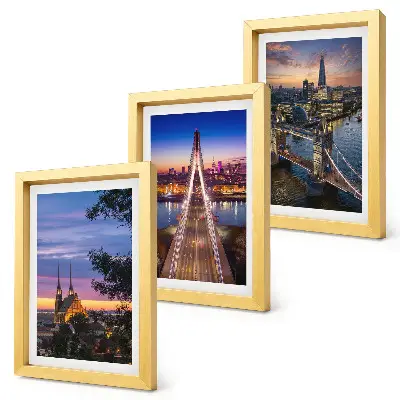 Bilderwand mit Stadtansichten von Brücken bei Sonnenuntergang
