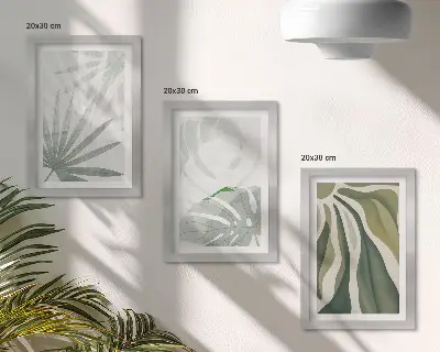 Bilderwand mit Pflanzenblättern in Grün- und Grautönen