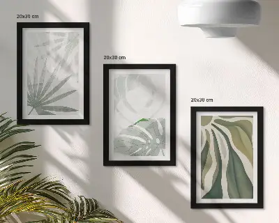 Bilderwand mit Pflanzenblättern in Grün- und Grautönen