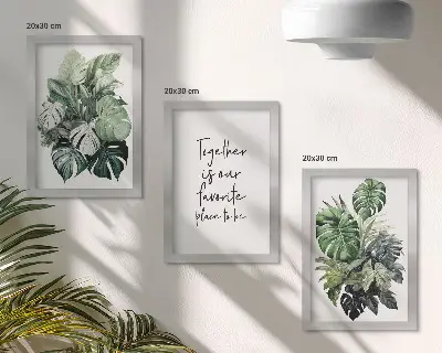 Bilderwand mit Motiv grüner tropischer Blätter und dekorativer Inschrift