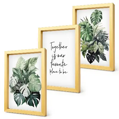 Bilderwand mit Motiv grüner tropischer Blätter und dekorativer Inschrift