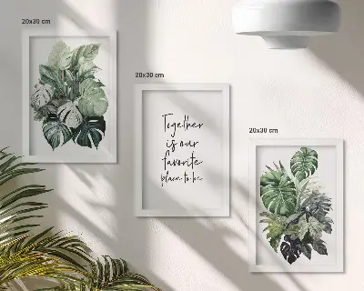 Bilderwand mit Motiv grüner tropischer Blätter und dekorativer Inschrift