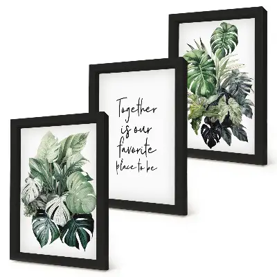 Bilderwand mit Motiv grüner tropischer Blätter und dekorativer Inschrift