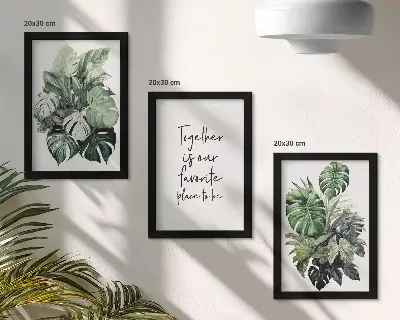 Bilderwand mit Motiv grüner tropischer Blätter und dekorativer Inschrift