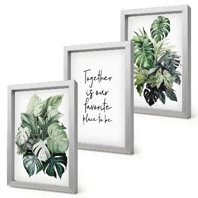 Bilderwand mit Motiv grüner tropischer Blätter und dekorativer Inschrift