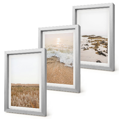 Bilderwand Strand mit Wellen und Kieselsteinen im Sommer