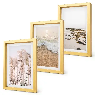 Bilderset mit Rahmen Strandgras, Wellen und Kieselsteine am Meer im Boho-Stil
