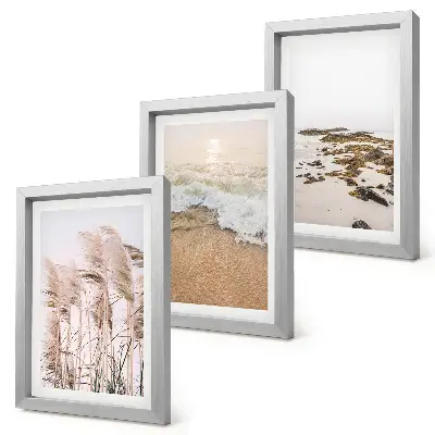 Bilderset mit Rahmen Strandgras, Wellen und Kieselsteine am Meer im Boho-Stil
