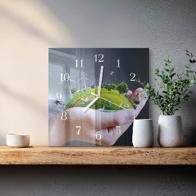 Quadratische wanduhr Erde in der Hand