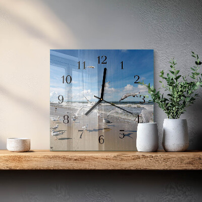 Quadratische wanduhr Möwen am Strand