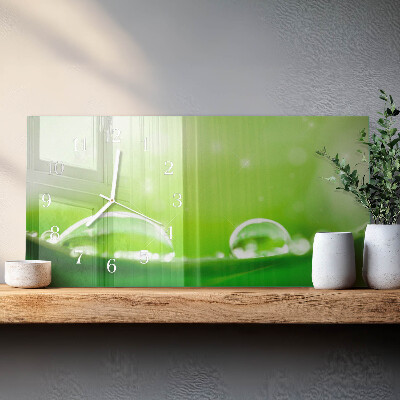 Horizontale glas wanduhr Tropfen auf einem Blatt
